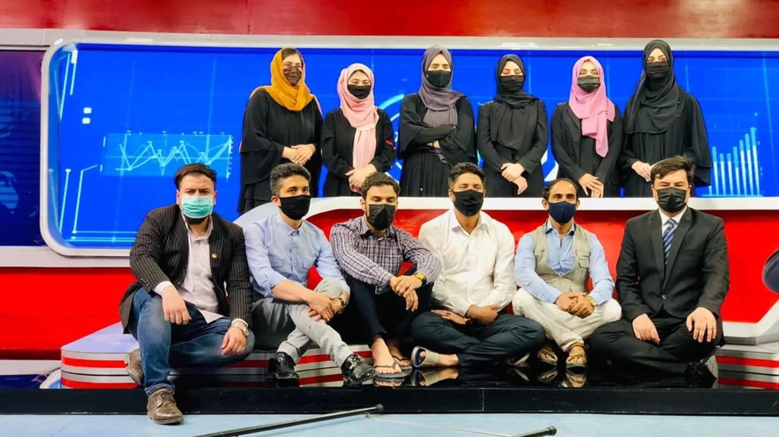 Male Afghan TV presenters mask up to support female colleagues after Taliban decreev